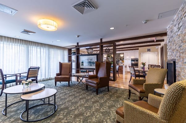 Well-furnished common area with seating and natural light