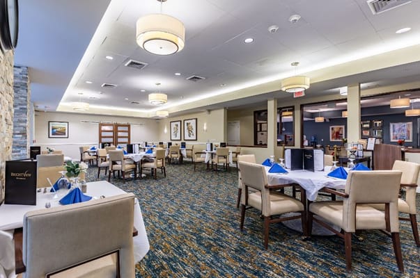 Dining area with tables set for residents