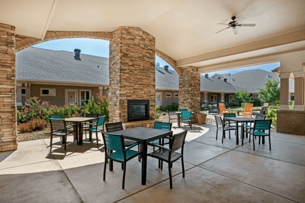Outdoor seating area with tables and chairs