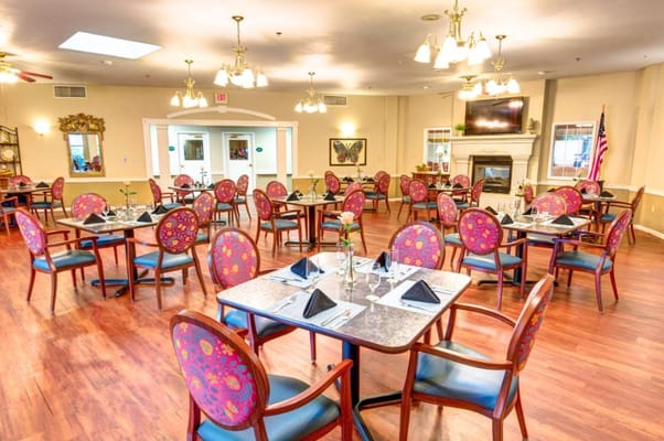 Dining area with tables set for meals at Brookstone Assisted Living Community