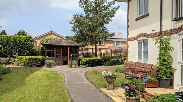 Garden area with seating and a garden shed