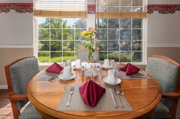 Dining room set with table and flowers