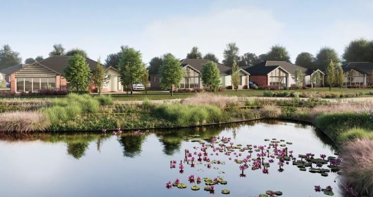 Scenic view of outdoor spaces with cottages and a pond