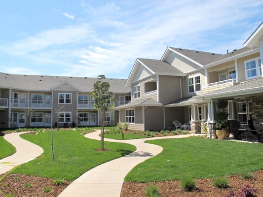 Well-maintained courtyard with paths and greenery at Camden Springs