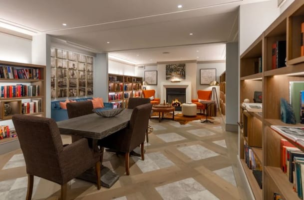 Cozy common area with bookshelves and seating