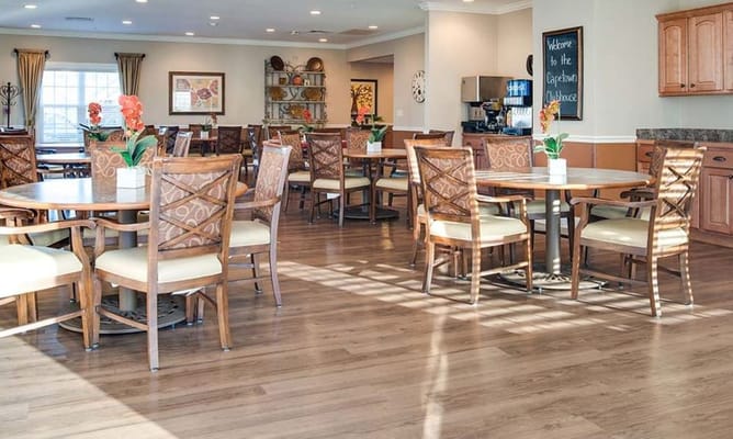 Bright dining area with wooden tables and chairs