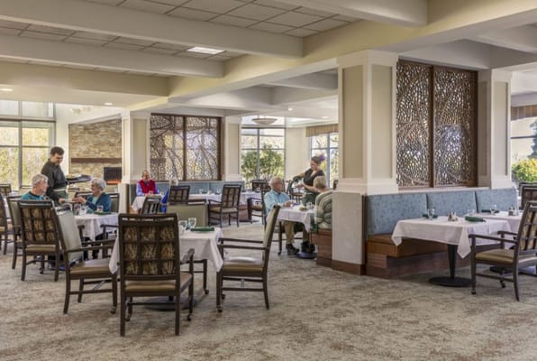 Residents dining in an elegant restaurant setting