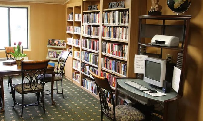 Cozy library area with bookshelves and seating