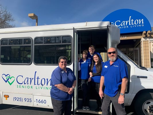 Staff at Carlton Senior Living with facility shuttle bus