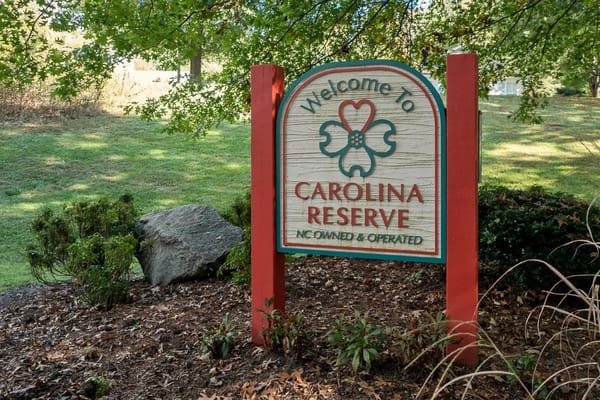 Welcome sign for Carolina Reserve senior living facility