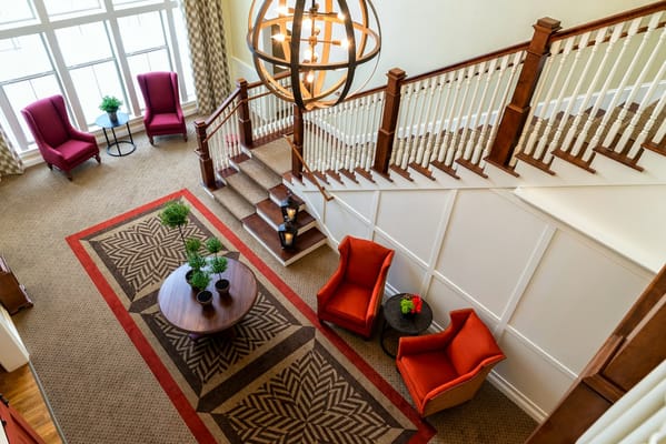 Bright common area with staircase and seating