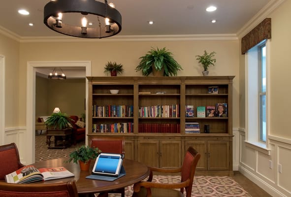 Cozy interior of a common area with bookshelves and seating