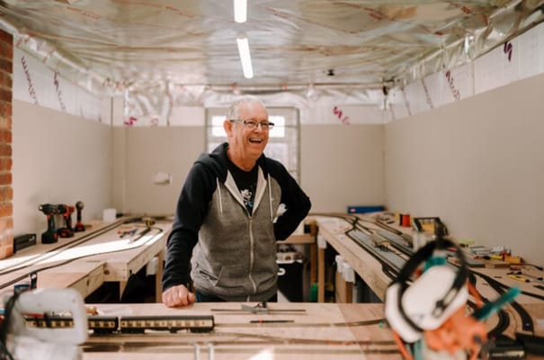Resident enjoying woodworking in a workshop