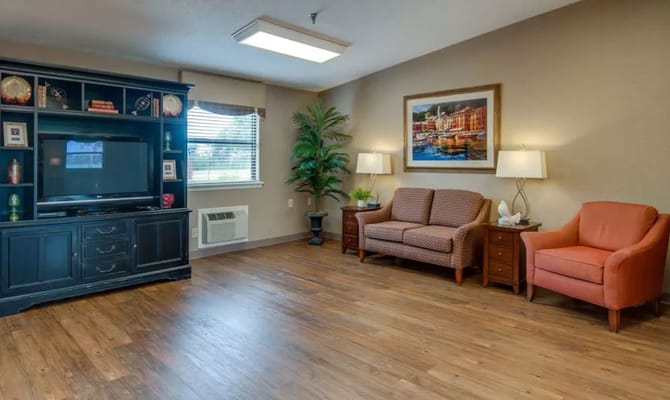 Living area with two sofas and a TV cabinet in Chaffee Nursing Center