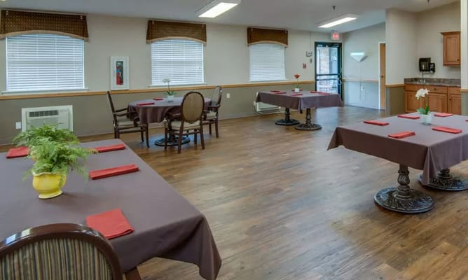 Spacious dining room with tables set for meals