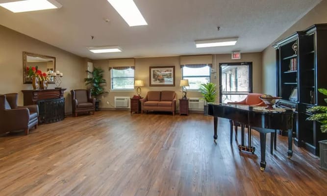 Cozy lobby with seating and a grand piano