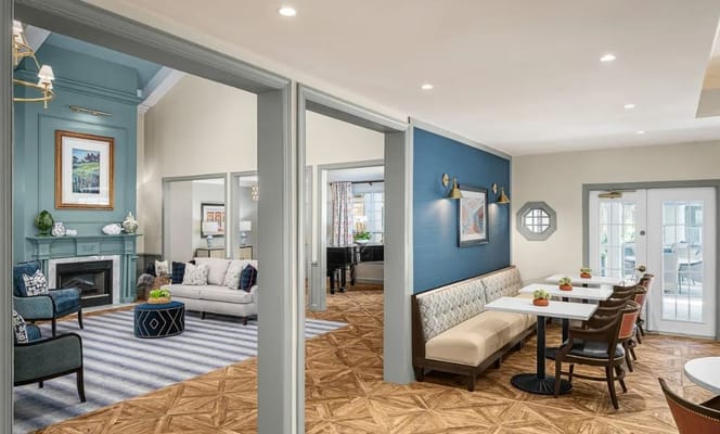 Bright common area with seating and tables