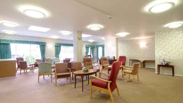 Bright common area with seating and floral decor