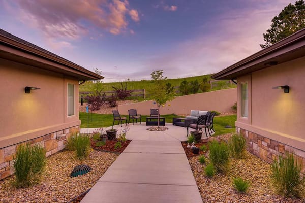 Outdoor garden area with seating and landscaping