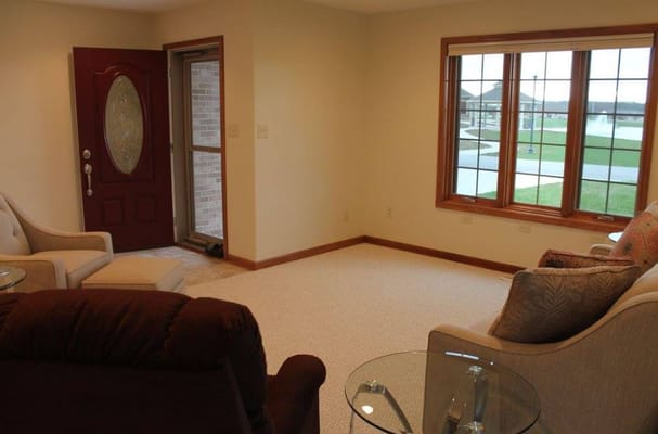 Bright common area with seating by large windows
