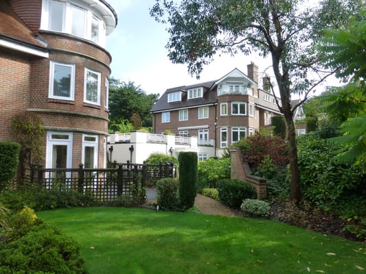 Well-maintained gardens and building exterior