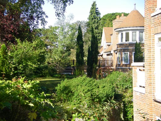 Building exterior with garden and landscaping