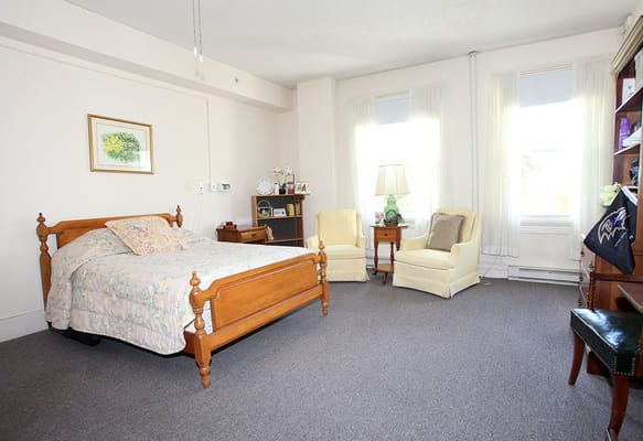 Cozy and inviting private resident room with natural light
