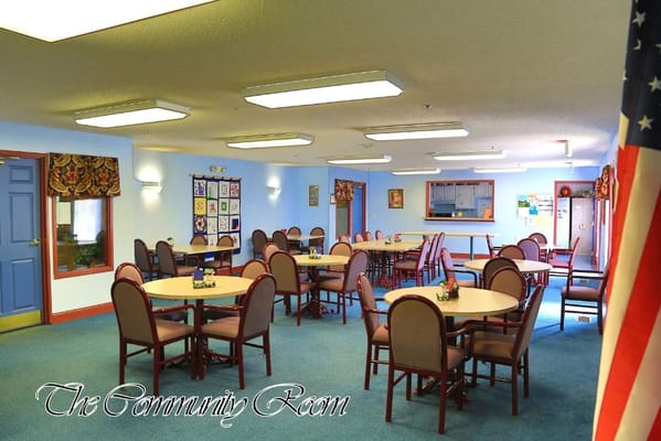 Interior view of the community room with tables and chairs