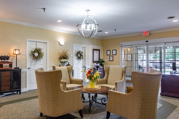 Bright common area with seating and flowers