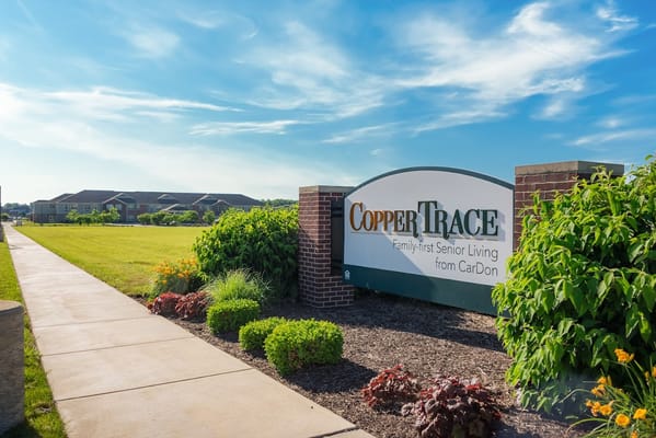 Exterior view of Copper Trace senior living facility sign
