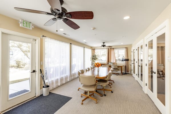 Bright and spacious common area with a dining setup