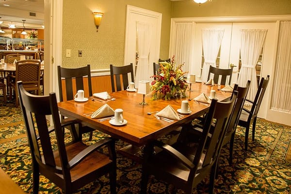 Interior dining room setup with table and chairs