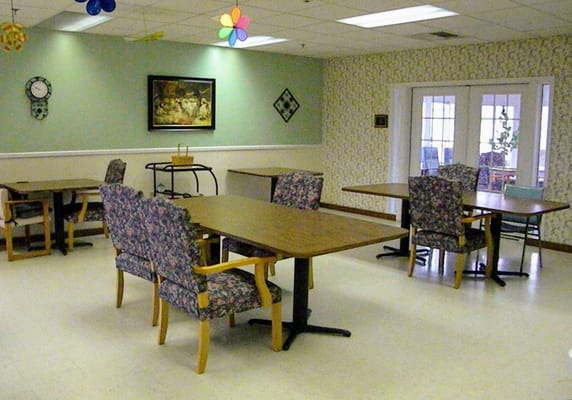 Bright interior common area with chairs and tables