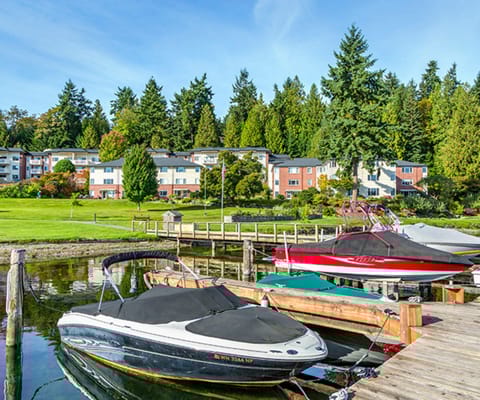Picturesque view of facility by the water with boats