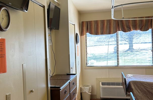 Interior view of a resident's room with amenities