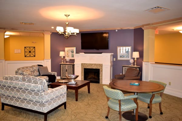 Spacious living room with seating and a fireplace