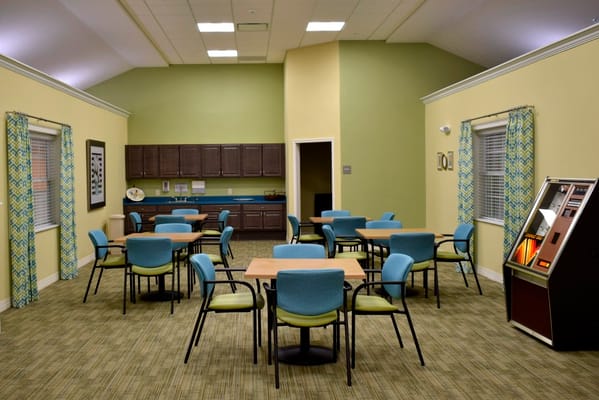 Bright common area with tables and chairs