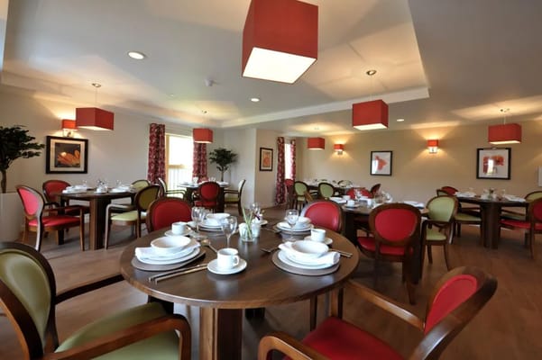 Bright and inviting dining room setup with tables and chairs