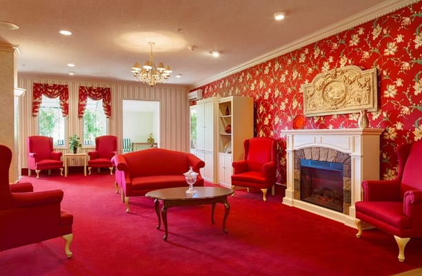Bright common area with red decor and comfortable seating
