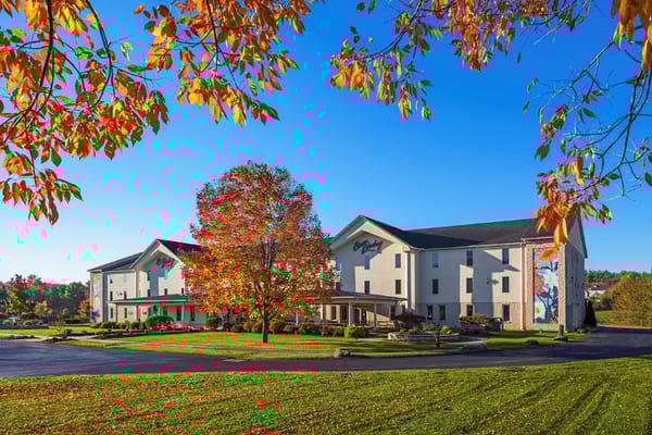 Exterior view of Easy Living Country Estates with autumn foliage