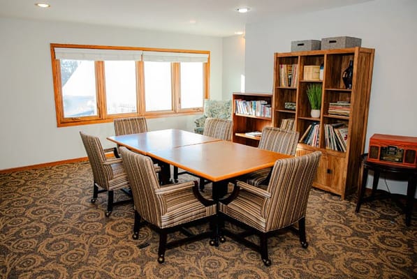 Bright common area with seating and bookshelves