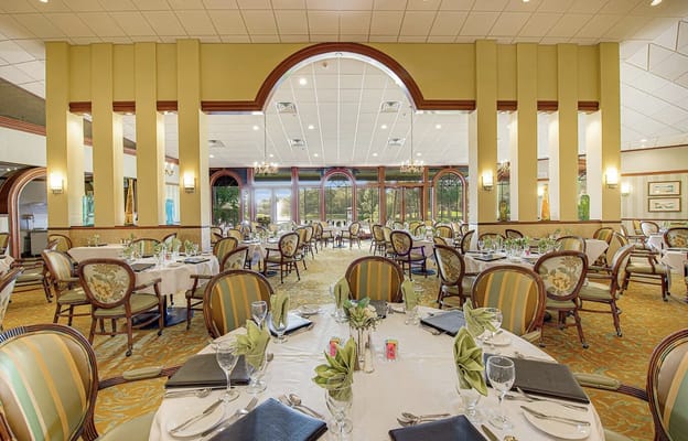 Spacious dining room with neatly set tables at Elancé at Sarasota.