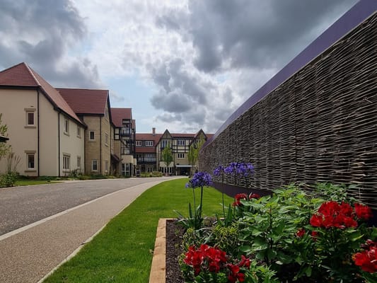 Exterior view of Elderswell Retirement Village with gardens