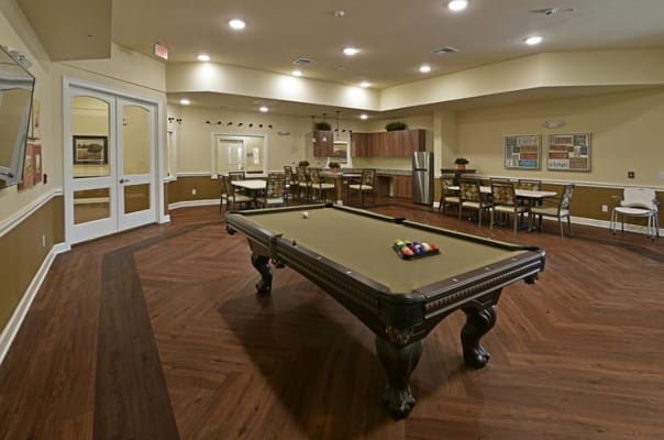 Interior common area with a pool table in focus.