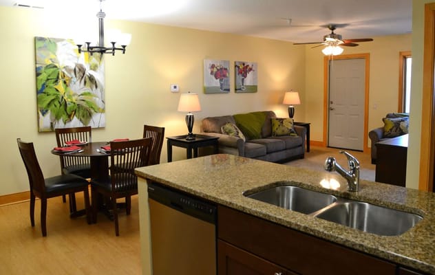 Cozy interior of a resident unit with dining area and living room