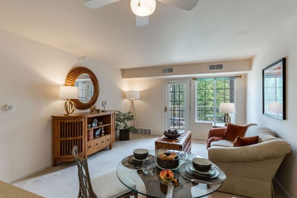 Bright living room with a dining table and comfortable seating