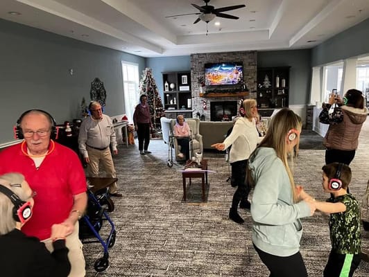Residents enjoying a silent disco in a common area