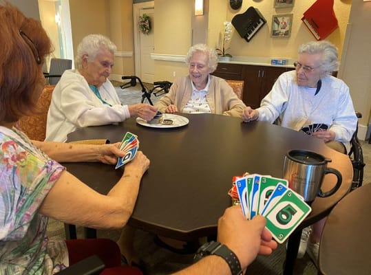 Residents playing cards in a common area