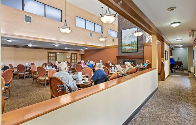 Residents enjoying a meal in the dining room.
