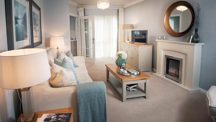 Spacious living room with modern decor and comfortable furniture.